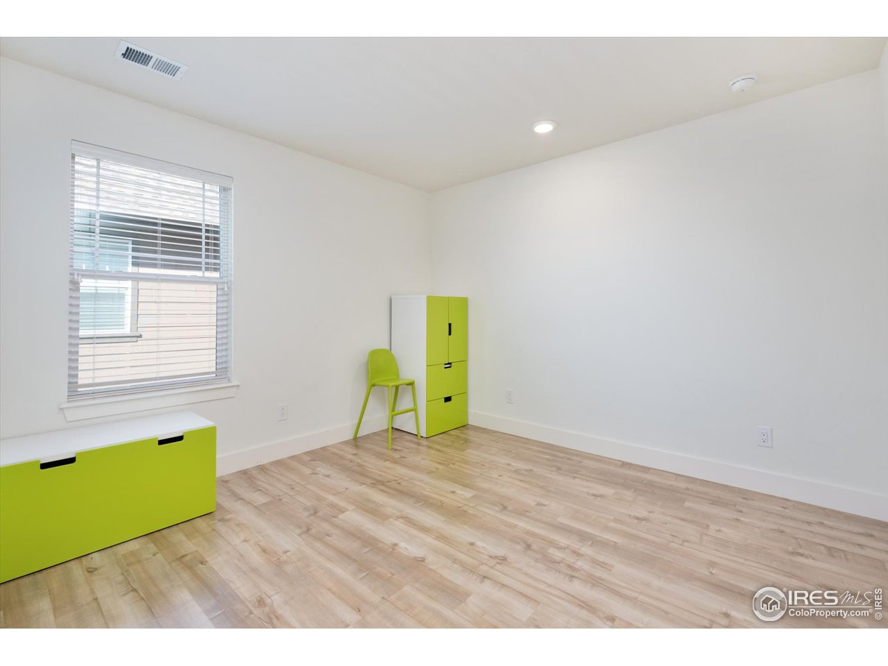 2159 Summerlin Lane Longmont, CO 80503 - Photo 29 of 37 a view of a room with window and wooden floor