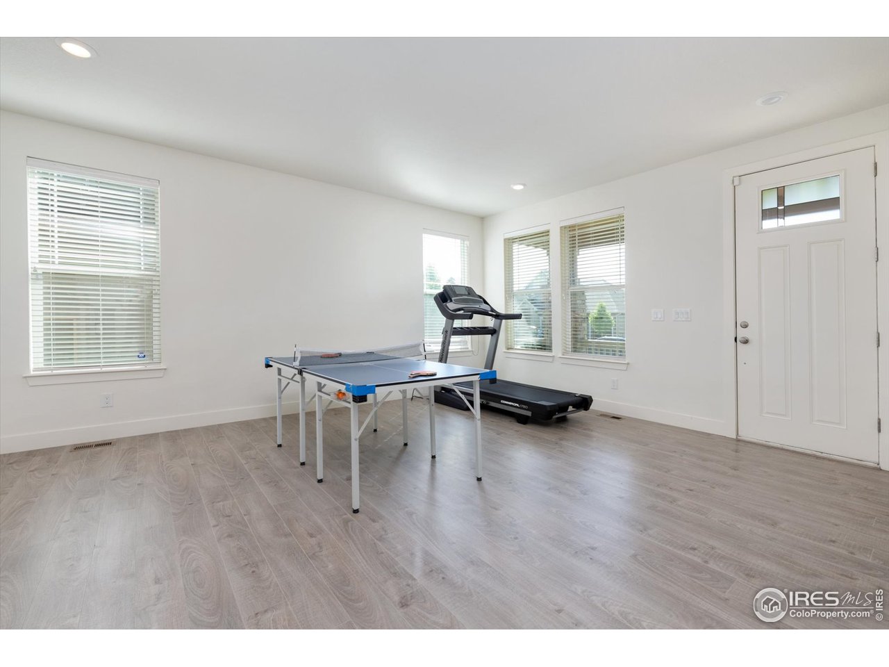 2159 Summerlin Lane Longmont, CO 80503 - Photo 3 of 37 a living room with furniture and a wooden floor