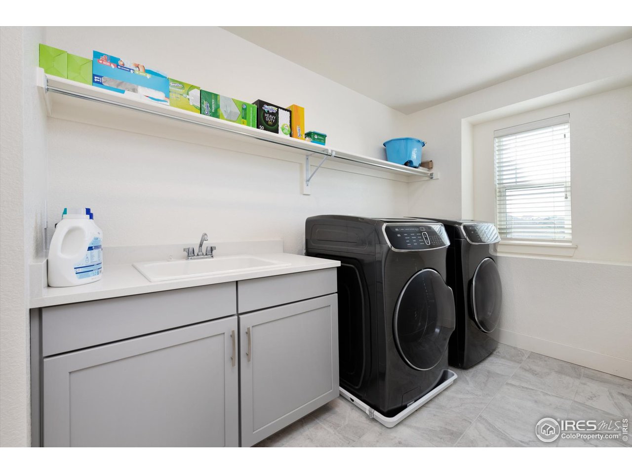 2159 Summerlin Lane Longmont, CO 80503 - Photo 31 of 37 a utility room with dryer and washer