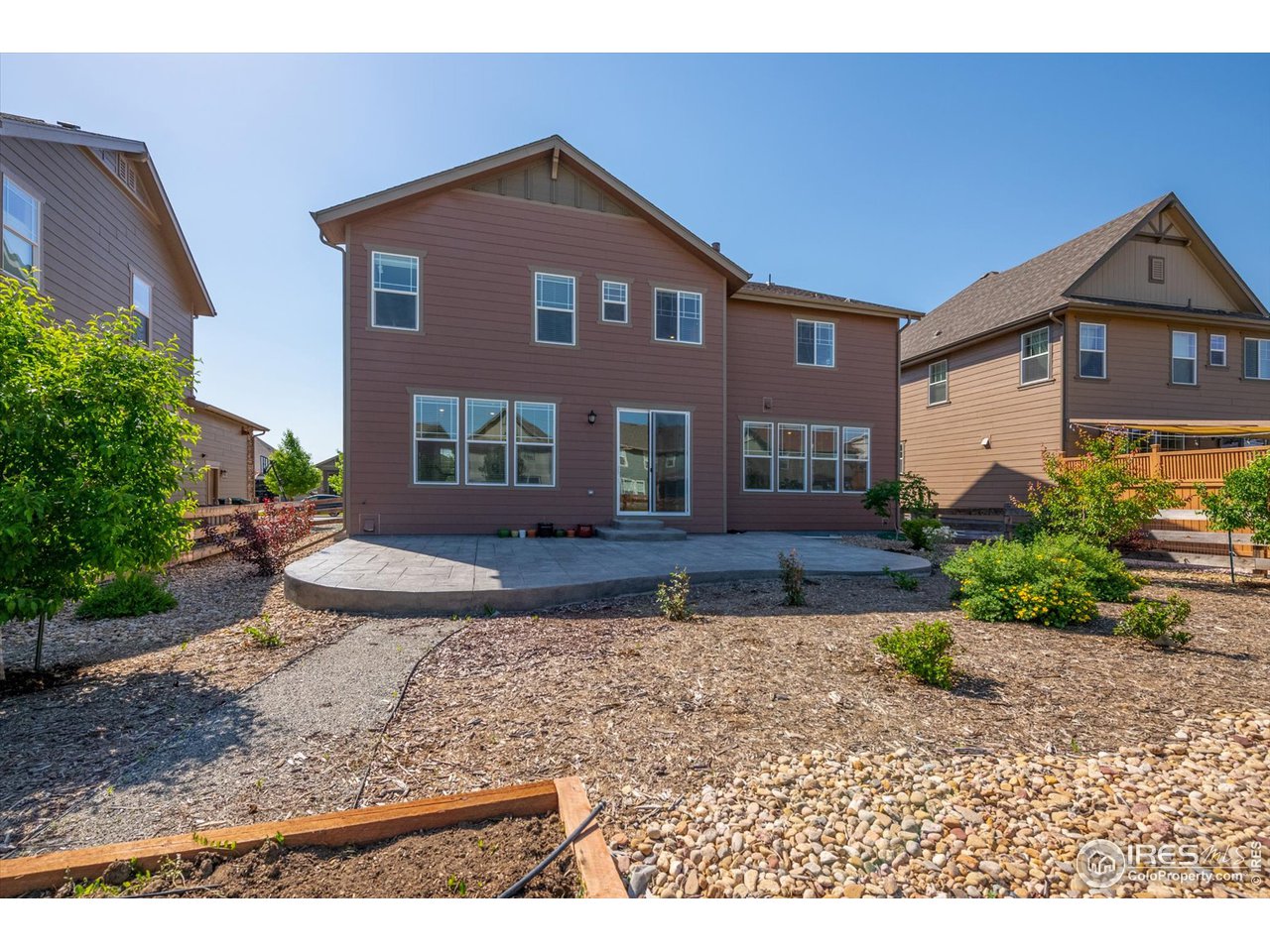 2159 Summerlin Lane Longmont, CO 80503 - Photo 36 of 37 a front view of a house with a yard