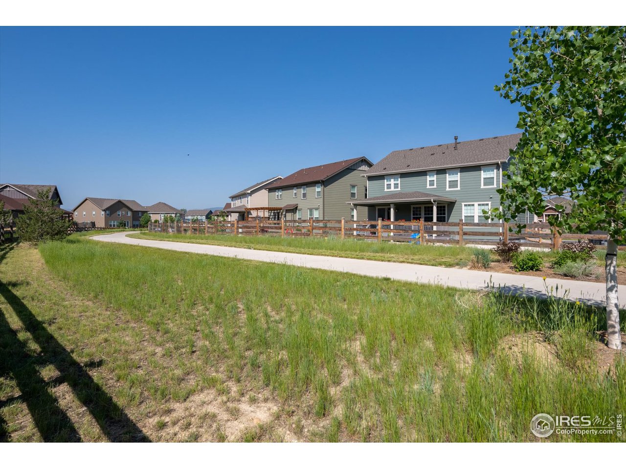 2159 Summerlin Lane Longmont, CO 80503 - Photo 37 of 37 a view of house with swimming pool yard and outdoor seating