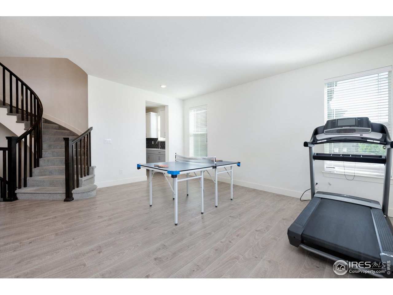 2159 Summerlin Lane Longmont, CO 80503 - Photo 4 of 37 a living room with furniture and a table