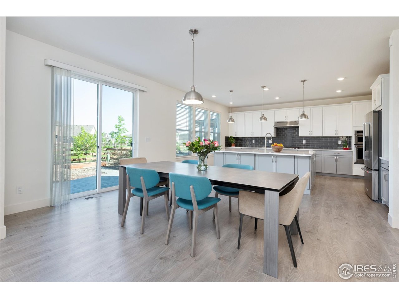 2159 Summerlin Lane Longmont, CO 80503 - Photo 7 of 37 a view of a dining room and livingroom view
