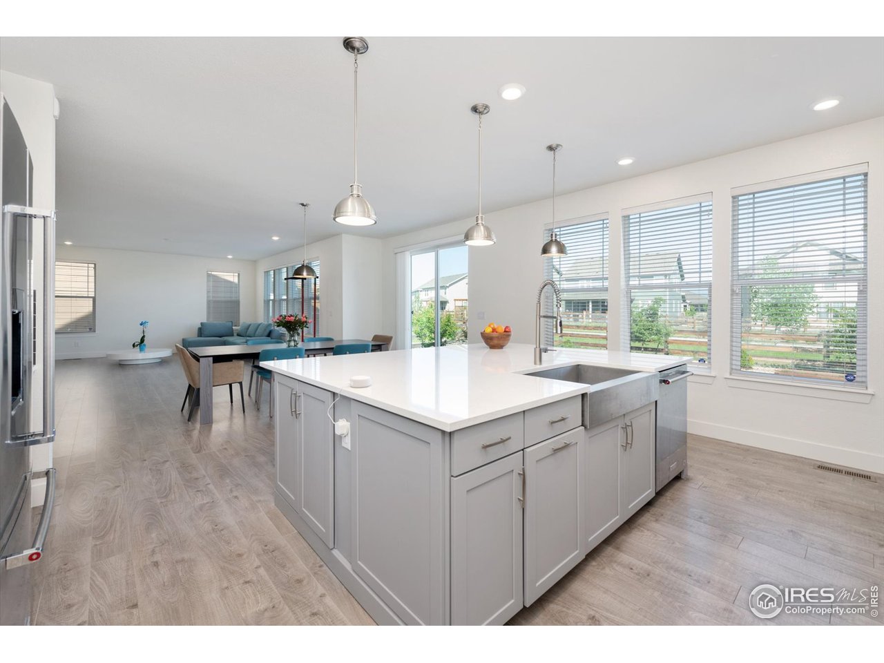 2159 Summerlin Lane Longmont, CO 80503 - Photo 10 of 37 a kitchen with granite countertop a sink and a stove