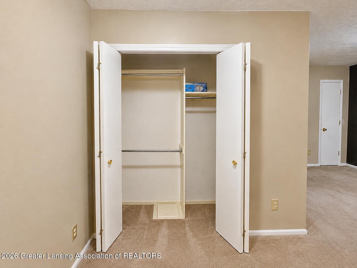225 East Jolly Road, Unit F2 Lansing, MI 48910 - Photo 10 of 27 Primary Bedroom Closet
