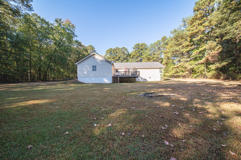 200 Lake Amah Lee Road Hampton, GA 30228 - Photo 3 of 29 a view of a house with a yard