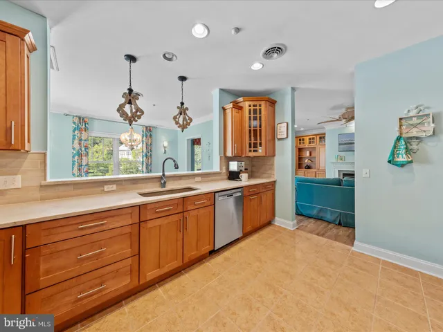 a spacious bathroom with a granite countertop sink mirror and a bathtub
