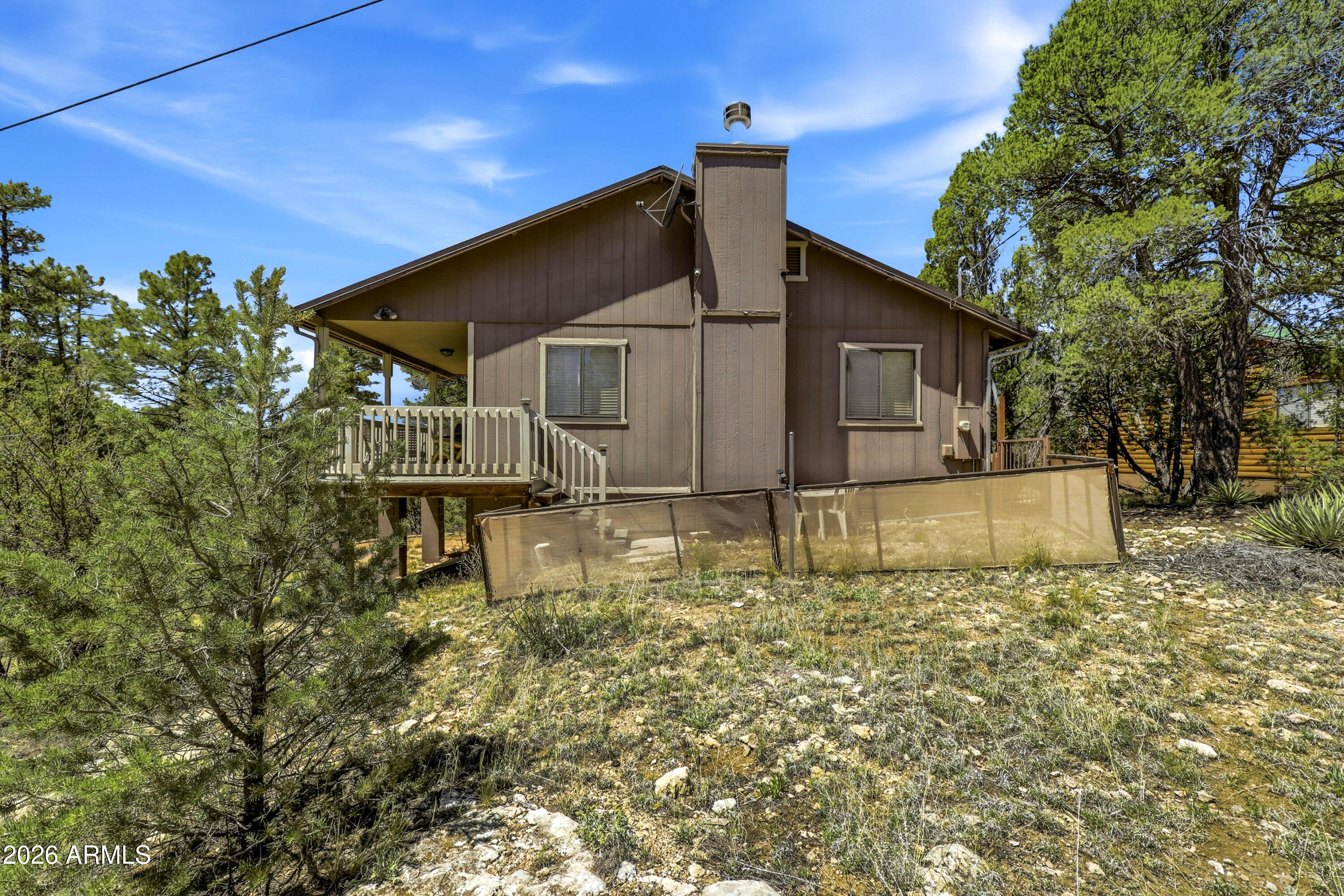 1992 Red Deer Run Overgaard, AZ 85933 - Photo 25 of 35 a house that has a tree in front of it