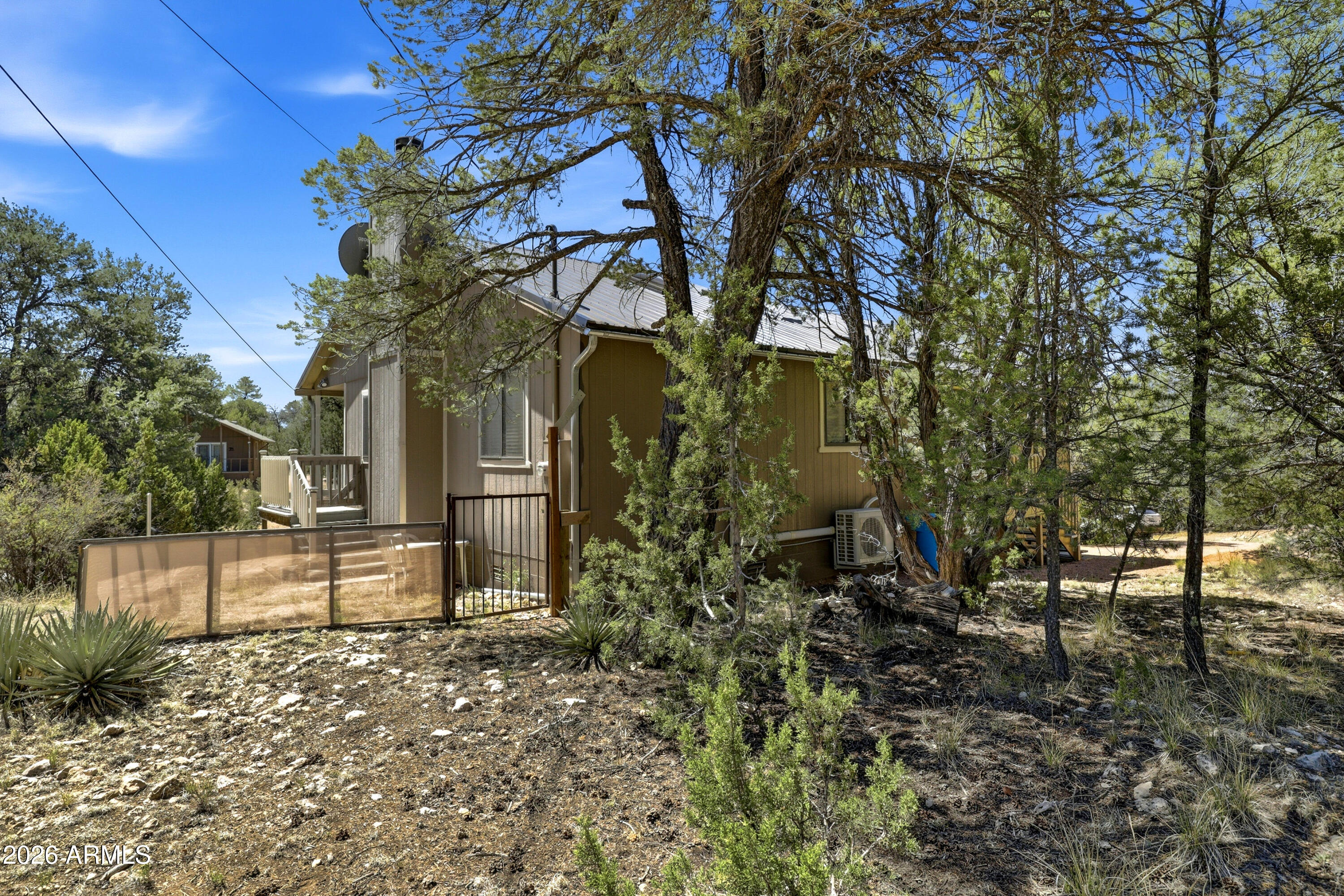 1992 Red Deer Run Overgaard, AZ 85933 - Photo 26 of 35 a view of a house with a yard