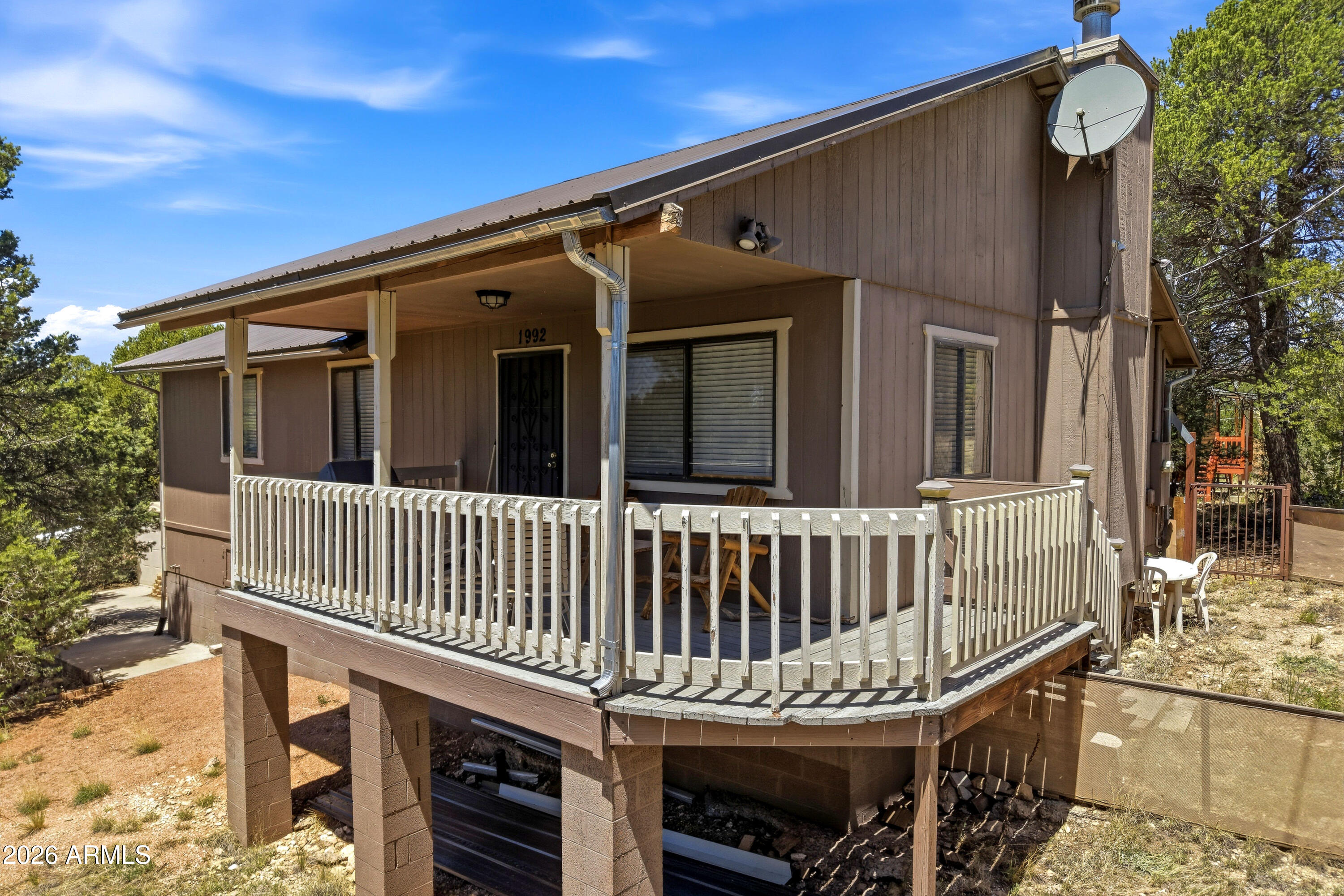 1992 Red Deer Run Overgaard, AZ 85933 - Photo 2 of 35 a view of a deck with a fence