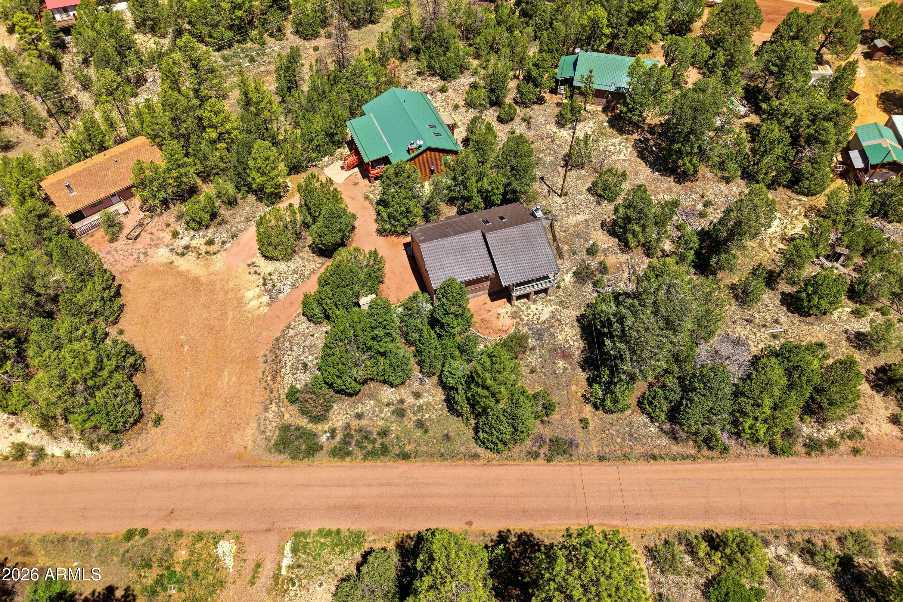 1992 Red Deer Run Overgaard, AZ 85933 - Photo 29 of 35 an aerial view of a house with a yard