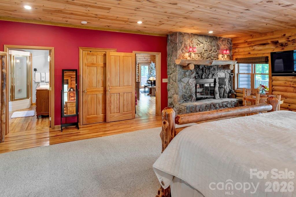 35 Falcon Crest Loop Maggie Valley, NC 28751 - Photo 15 of 46 a bedroom with furniture and a chandelier