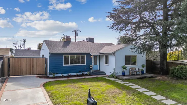 a view of house with swimming pool and porch with furniture