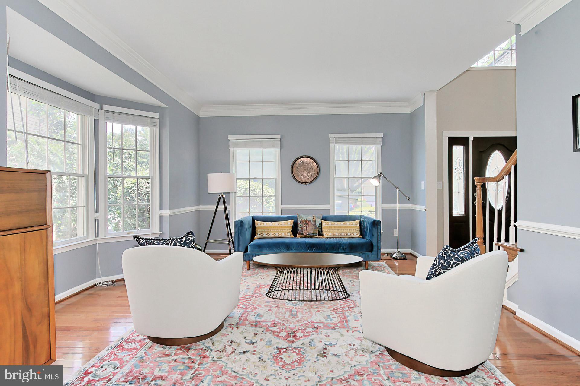 Welcoming Living Room w/ Wood Floors & Bay Window