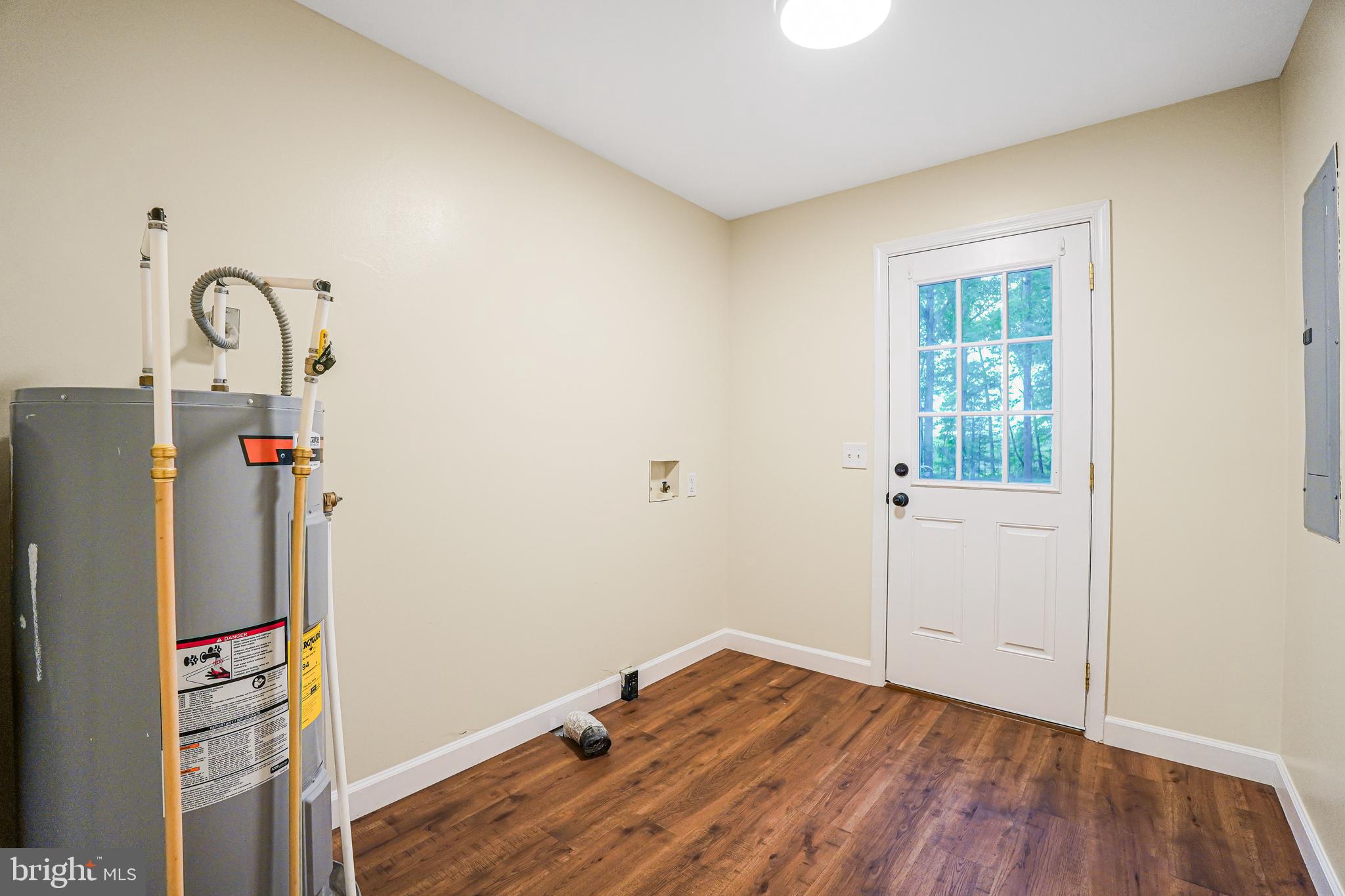 767 Loving Road Zion Crossroads, VA 22942 - Photo 21 of 33 a room with a window and wooden floor