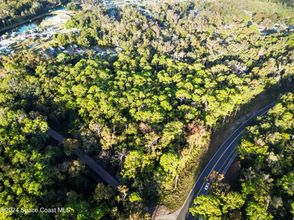 a view of multiple houses with yard