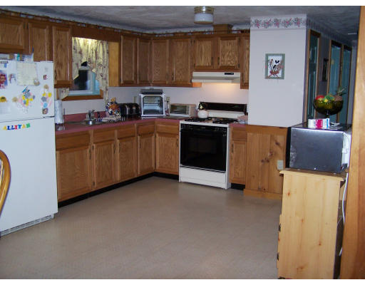 710 Royalston Road Phillipston, MA 01331 - Photo 14 of 25 a kitchen with sink a refrigerator and a stove