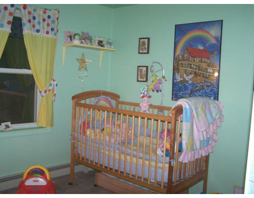 710 Royalston Road Phillipston, MA 01331 - Photo 23 of 25 a bedroom with a bed and wooden floor