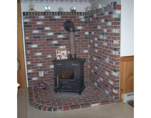 710 Royalston Road Phillipston, MA 01331 - Photo 7 of 25 a brick building with a bench in front of door