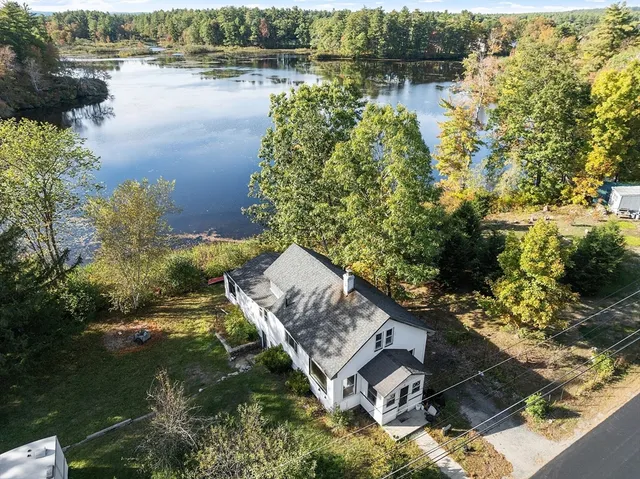 a aerial view of a house with a lake view