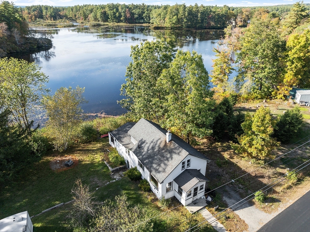 a aerial view of a house with a lake view