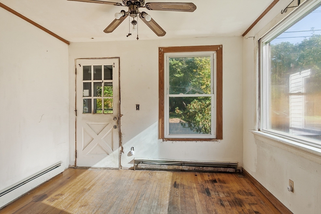 31 South Street Townsend, MA 01469 - Photo 11 of 42 a view of empty room with wooden floor and fan