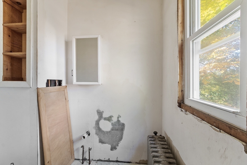 31 South Street Townsend, MA 01469 - Photo 15 of 42 a bathroom with a window and a view of rack