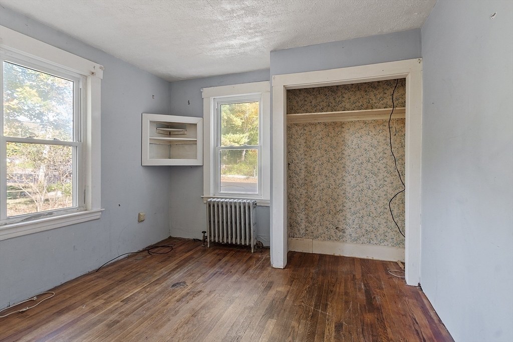 31 South Street Townsend, MA 01469 - Photo 17 of 42 an empty room with wooden floor and windows