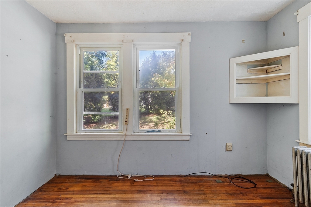 31 South Street Townsend, MA 01469 - Photo 18 of 42 a view of an empty room with wooden floor and a window