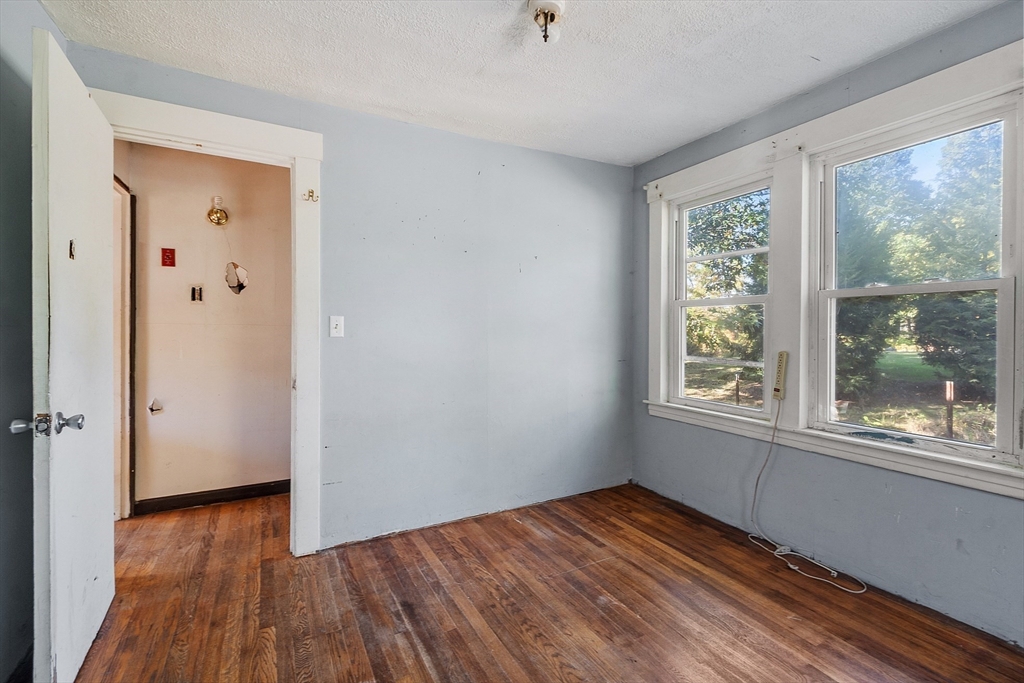 31 South Street Townsend, MA 01469 - Photo 19 of 42 an empty room with wooden floor and windows