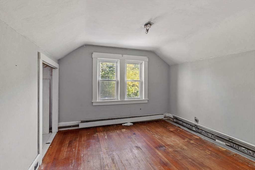 31 South Street Townsend, MA 01469 - Photo 24 of 42 an empty room with wooden floor and windows