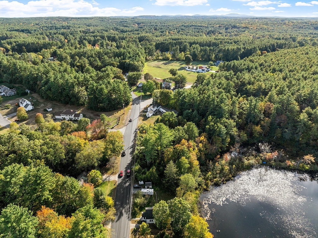 31 South Street Townsend, MA 01469 - Photo 37 of 42 a view of a forest with trees and houses