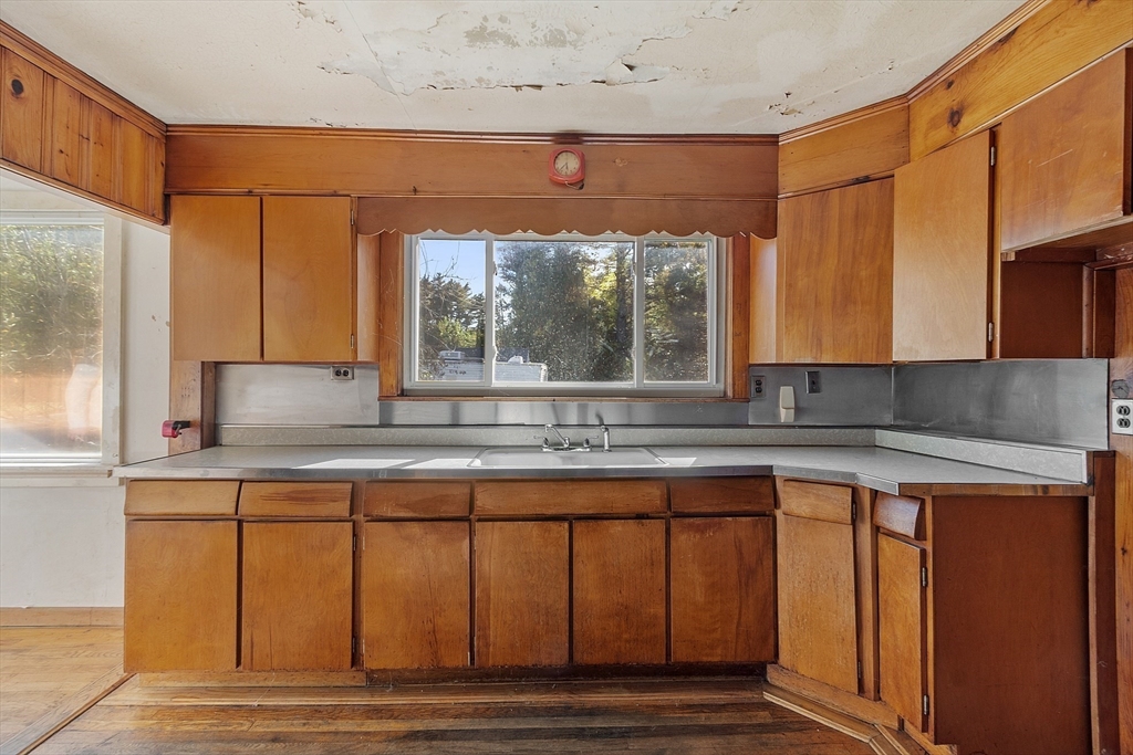 31 South Street Townsend, MA 01469 - Photo 6 of 42 a kitchen with a sink window and cabinets