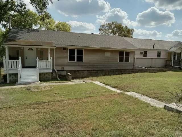 a house view with a garden space