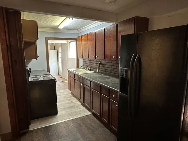 a kitchen with counter top space and stainless steel appliances