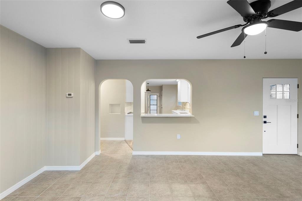 124 Evergreen Avenue Edgewater, FL 32132 - Photo 13 of 36 a view of a livingroom with a staircase