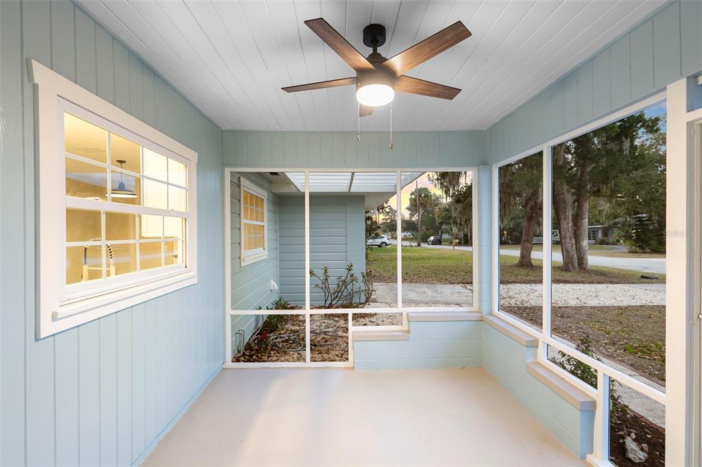 124 Evergreen Avenue Edgewater, FL 32132 - Photo 20 of 36 a room with natural light and floor to ceiling windows