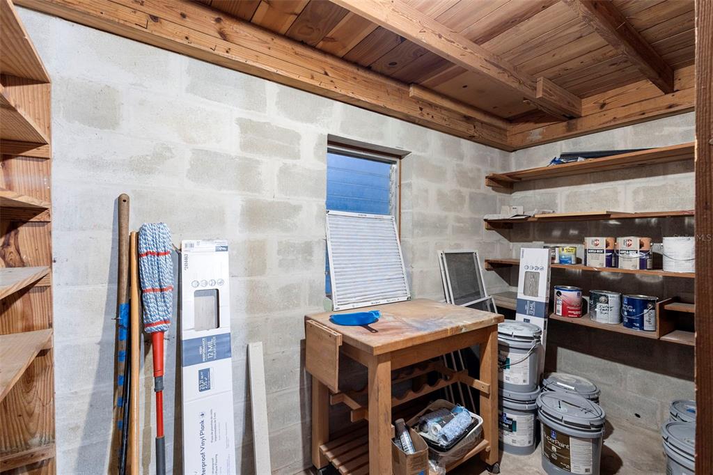 124 Evergreen Avenue Edgewater, FL 32132 - Photo 24 of 36 a backyard of a house with wooden chairs