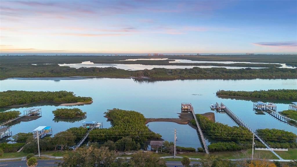 124 Evergreen Avenue Edgewater, FL 32132 - Photo 26 of 36 an aerial view of a house with a lake view