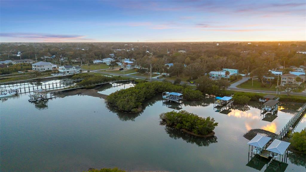 124 Evergreen Avenue Edgewater, FL 32132 - Photo 27 of 36 an aerial view of a city with lots of residential buildings ocean and mountain view in back