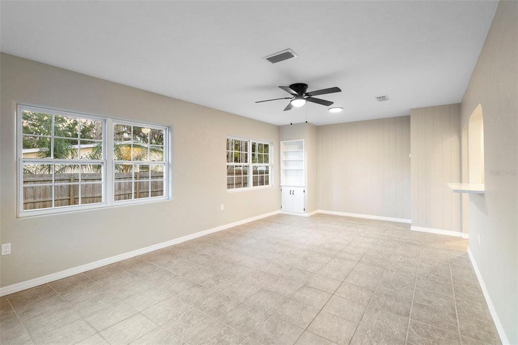 124 Evergreen Avenue Edgewater, FL 32132 - Photo 10 of 36 a view of an empty room with a window