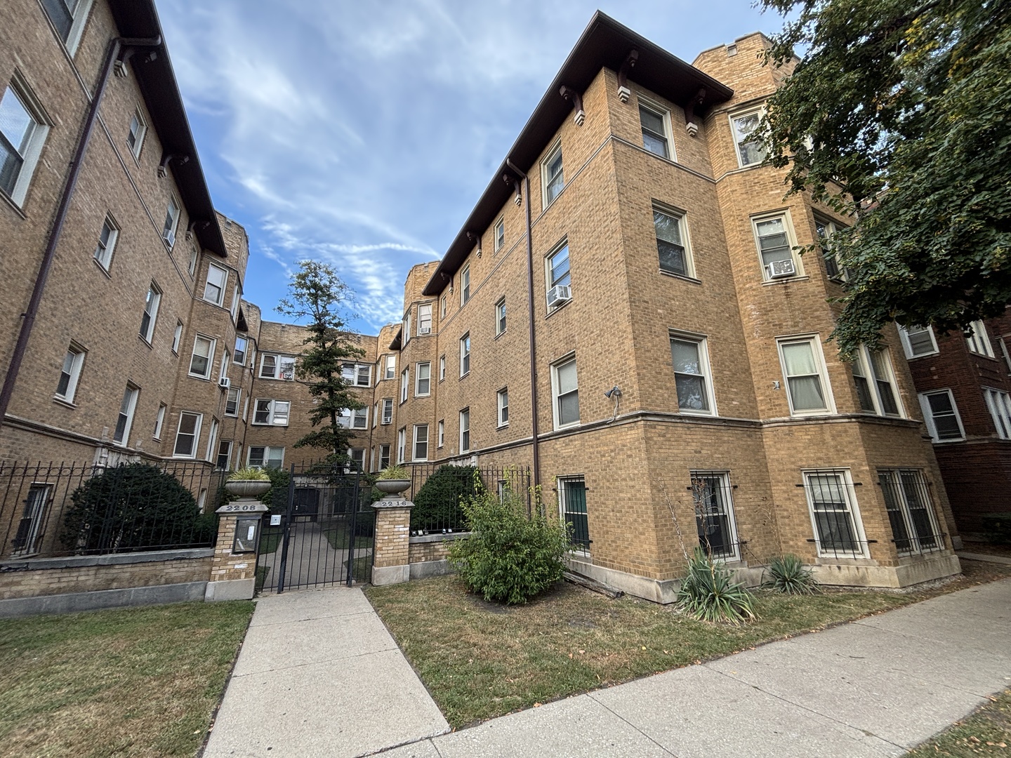2212 East 70th Street, Unit 2D Chicago, IL 60649 - Photo 8 of 8 a front view of a house with yard