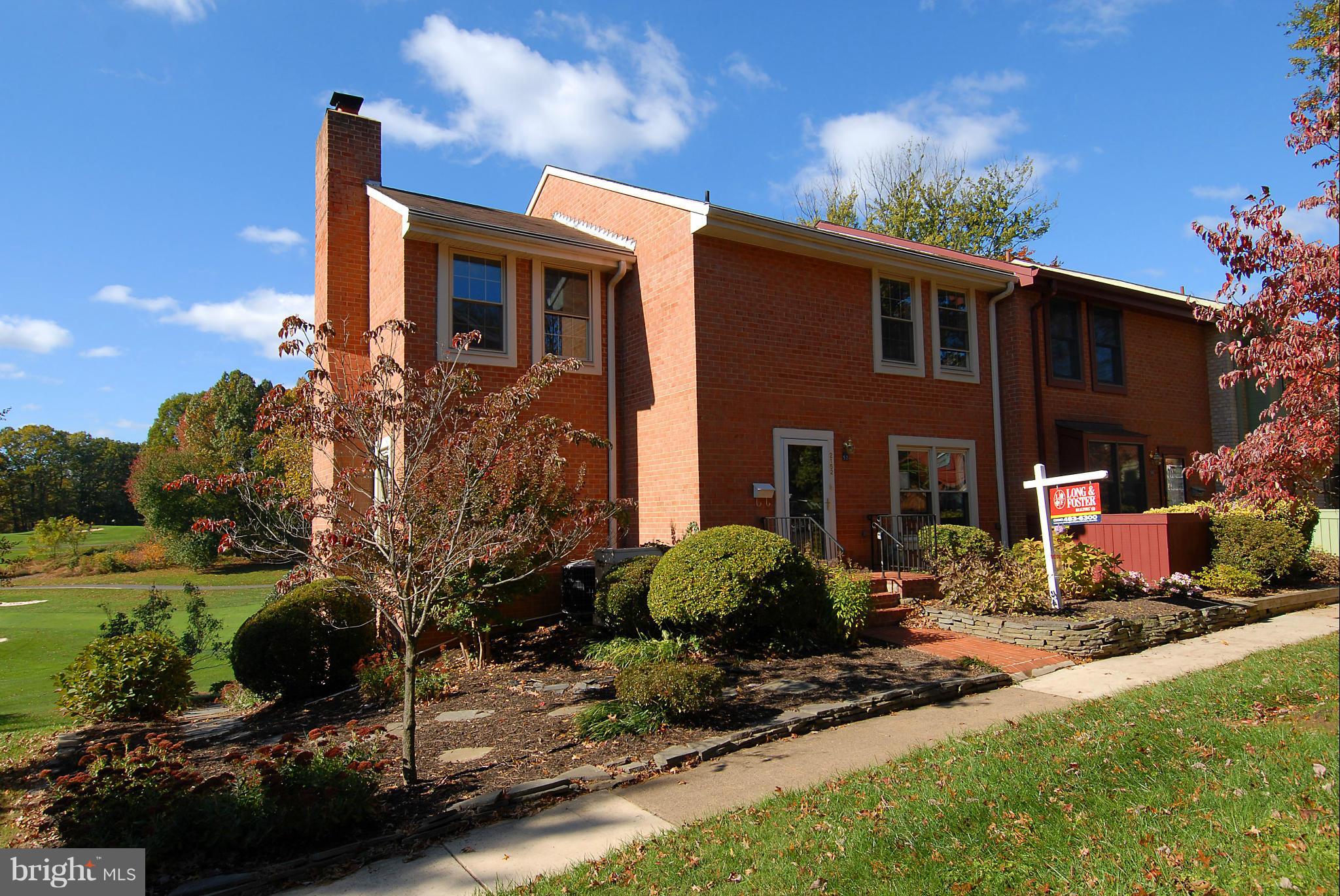 2152 Golf Course Drive Reston, VA 20191 - Photo 1 of 27 a front view of a house with garden