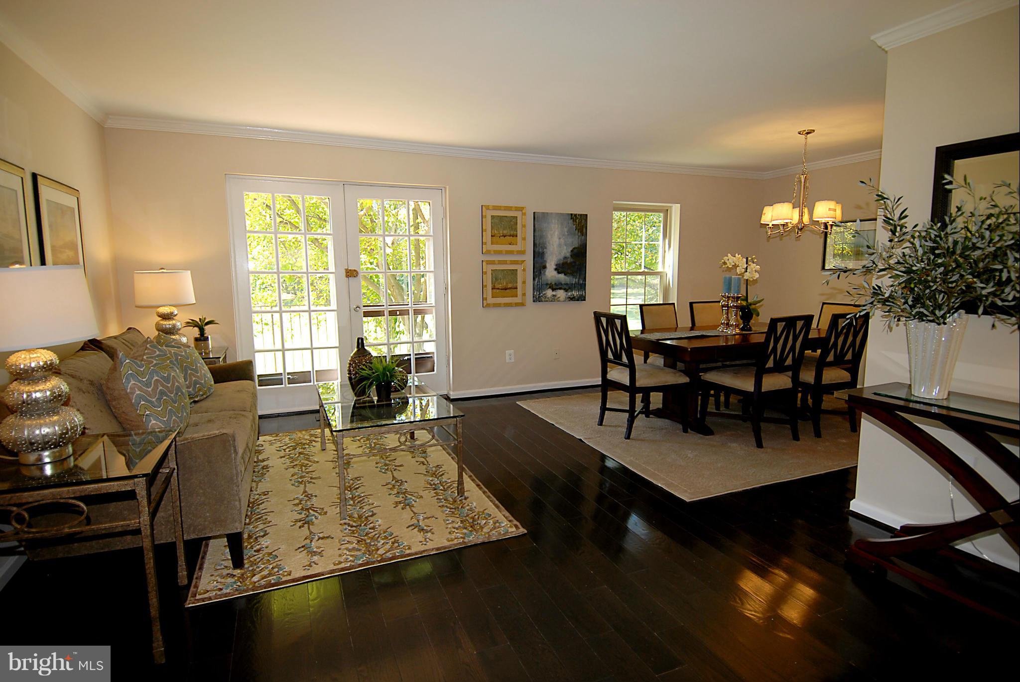2152 Golf Course Drive Reston, VA 20191 - Photo 12 of 27 a view of a dining room with furniture and wooden floor