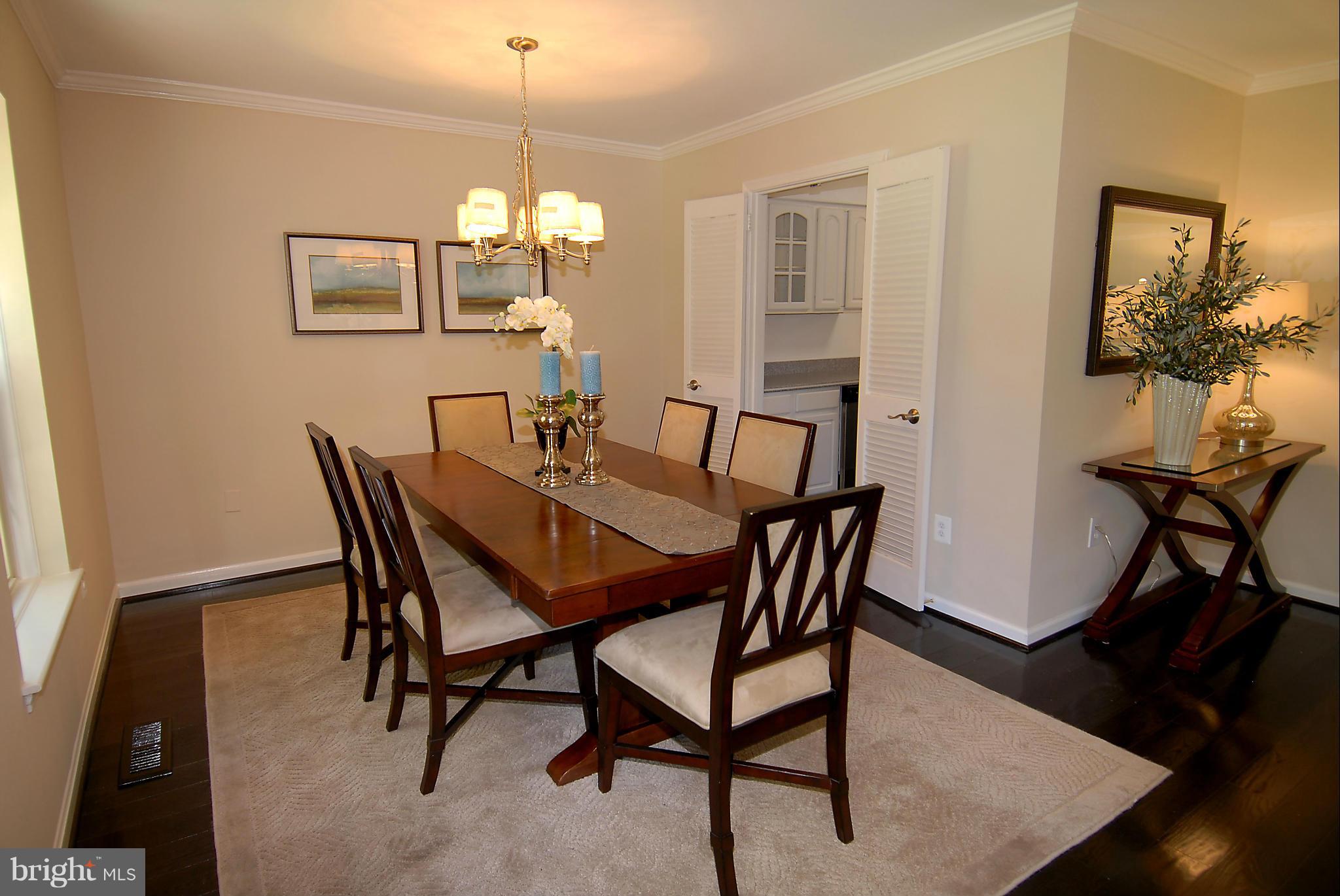 2152 Golf Course Drive Reston, VA 20191 - Photo 13 of 27 a view of a dining room with furniture and wooden floor