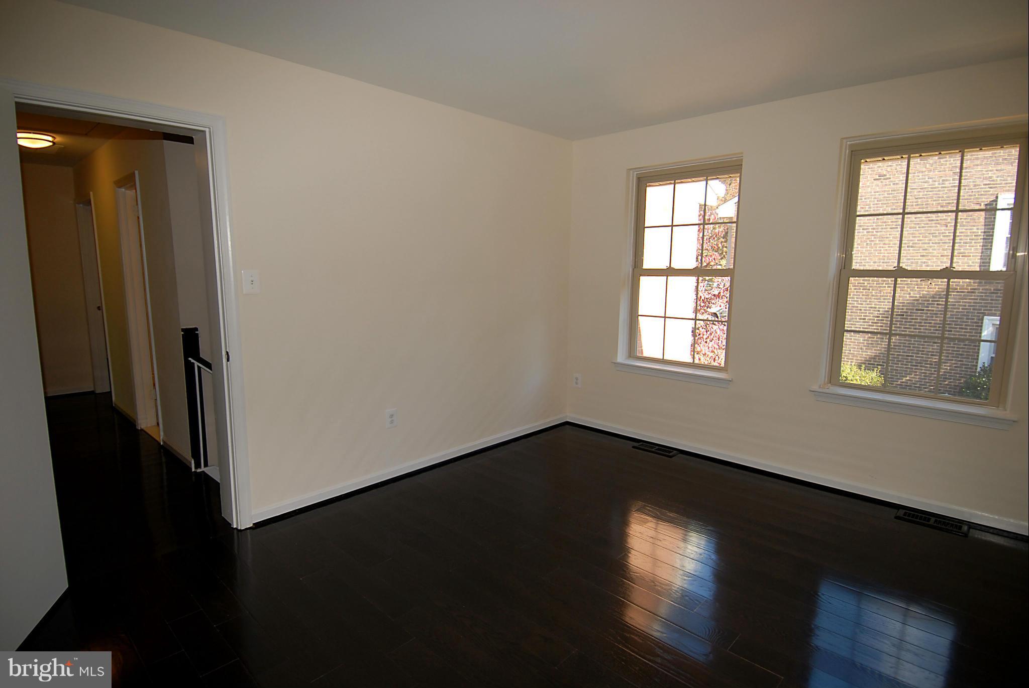 2152 Golf Course Drive Reston, VA 20191 - Photo 19 of 27 a view of an empty room with wooden floor and a window