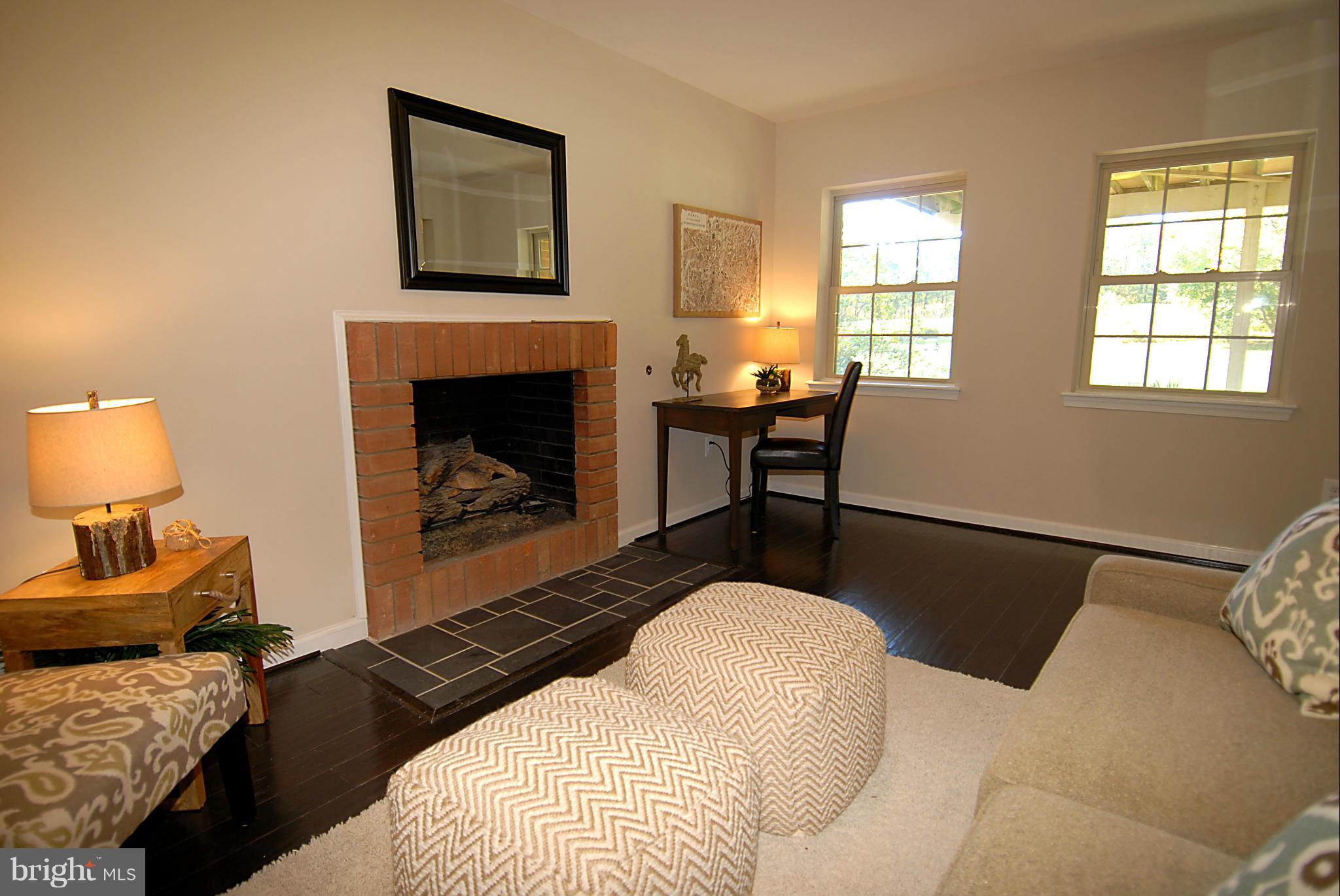 2152 Golf Course Drive Reston, VA 20191 - Photo 21 of 27 a bedroom with a bed and a fireplace