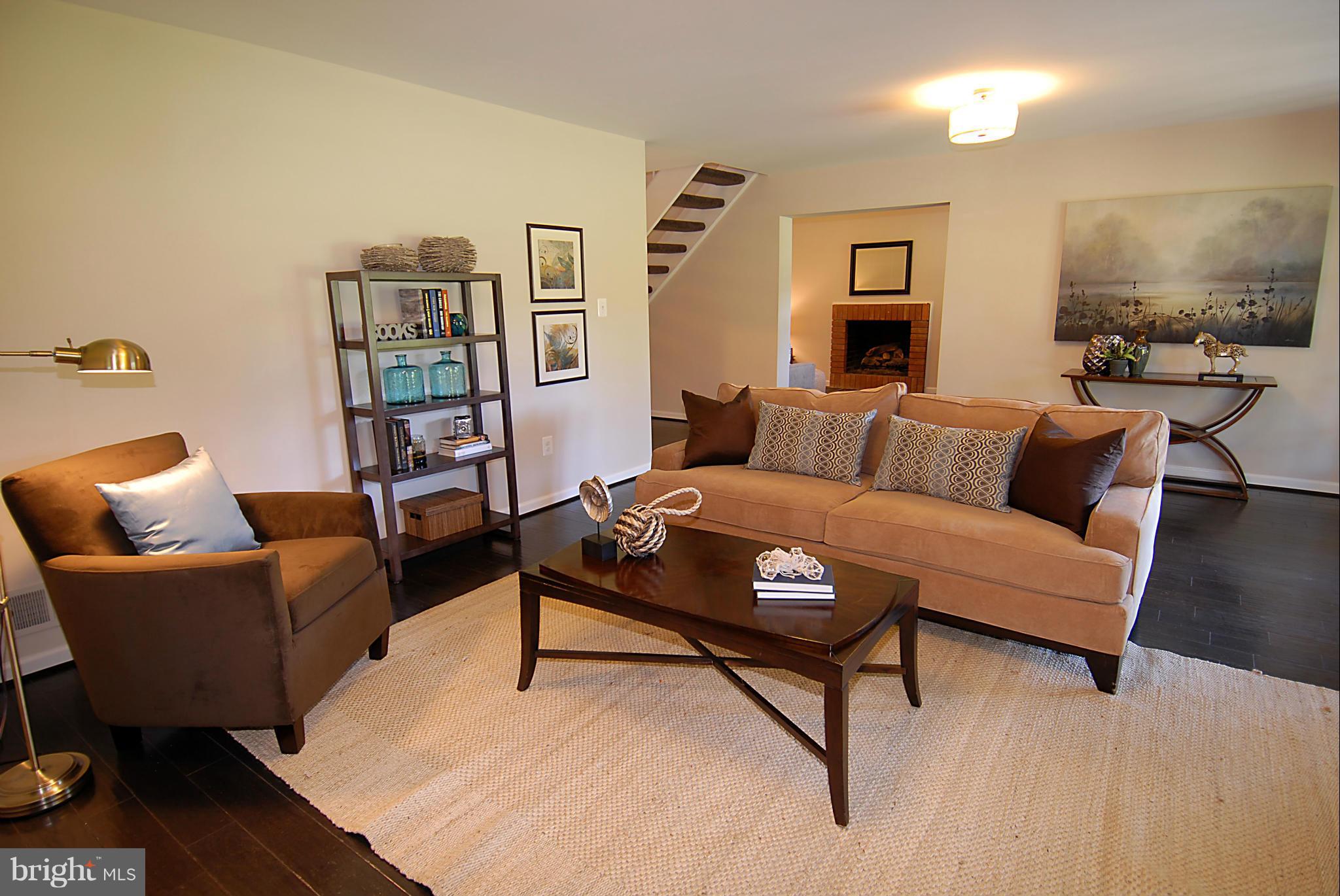 2152 Golf Course Drive Reston, VA 20191 - Photo 22 of 27 a living room with furniture and a wooden floor