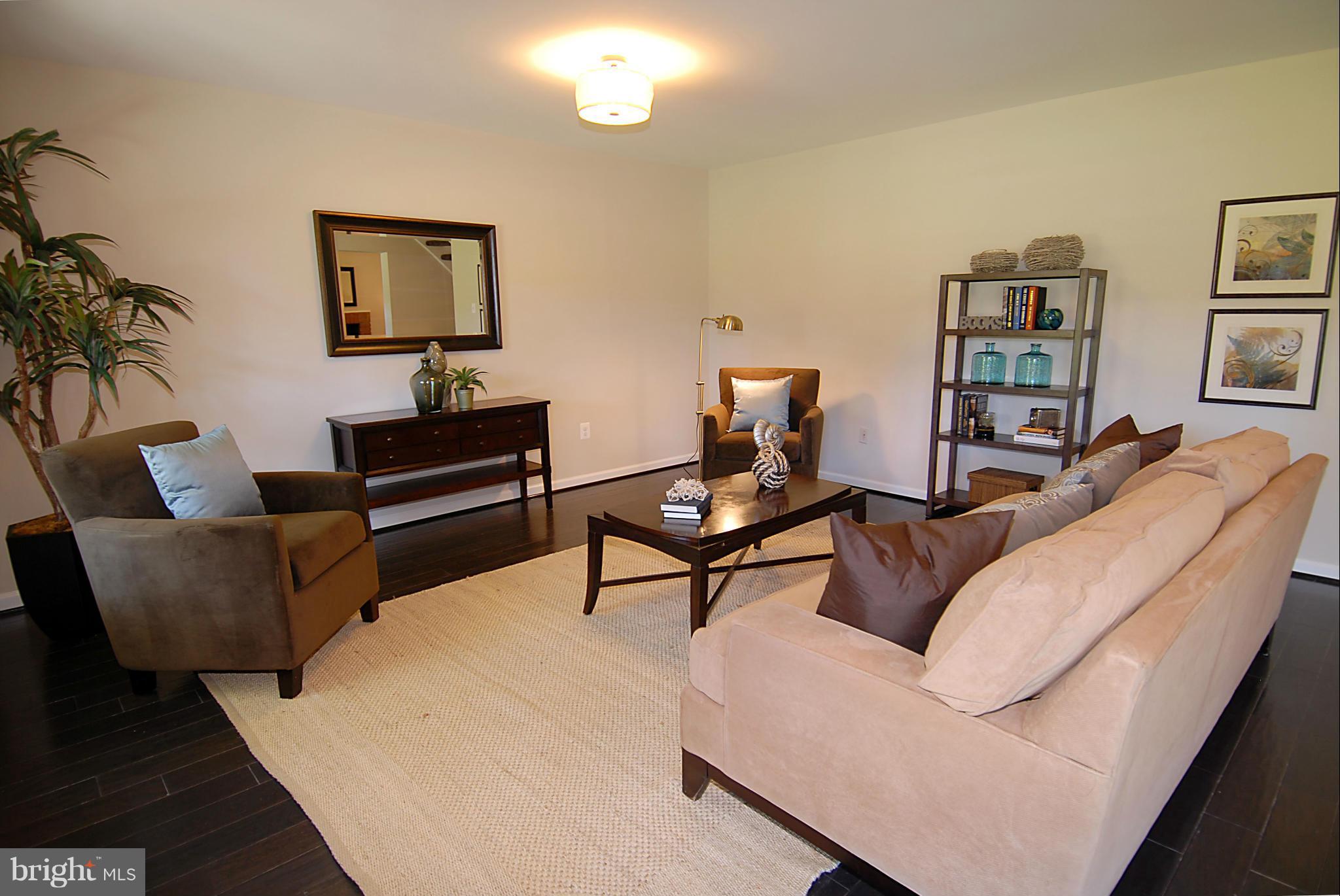 2152 Golf Course Drive Reston, VA 20191 - Photo 23 of 27 a living room with furniture and a wooden floor