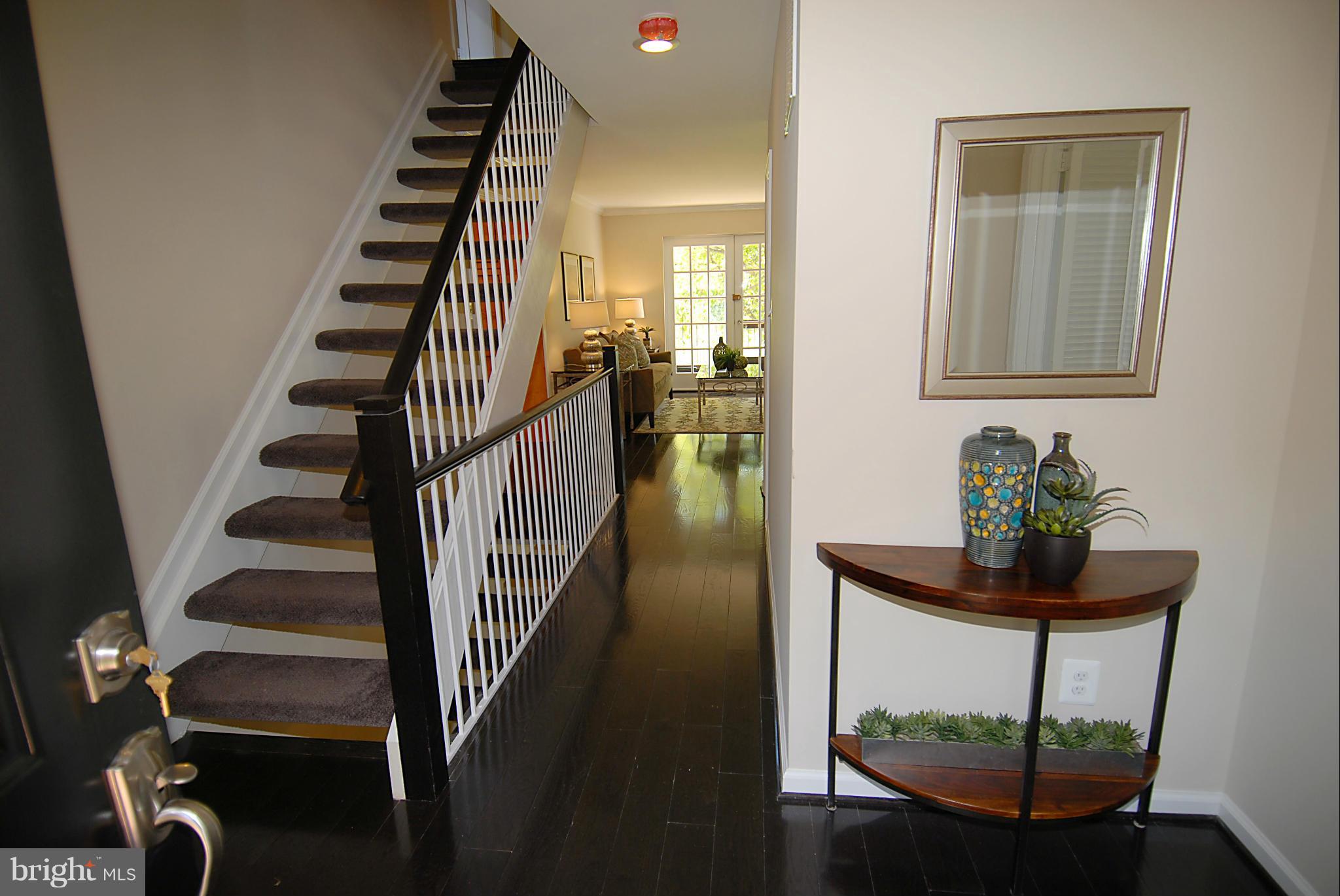 2152 Golf Course Drive Reston, VA 20191 - Photo 4 of 27 a view of entryway and hall with wooden floor